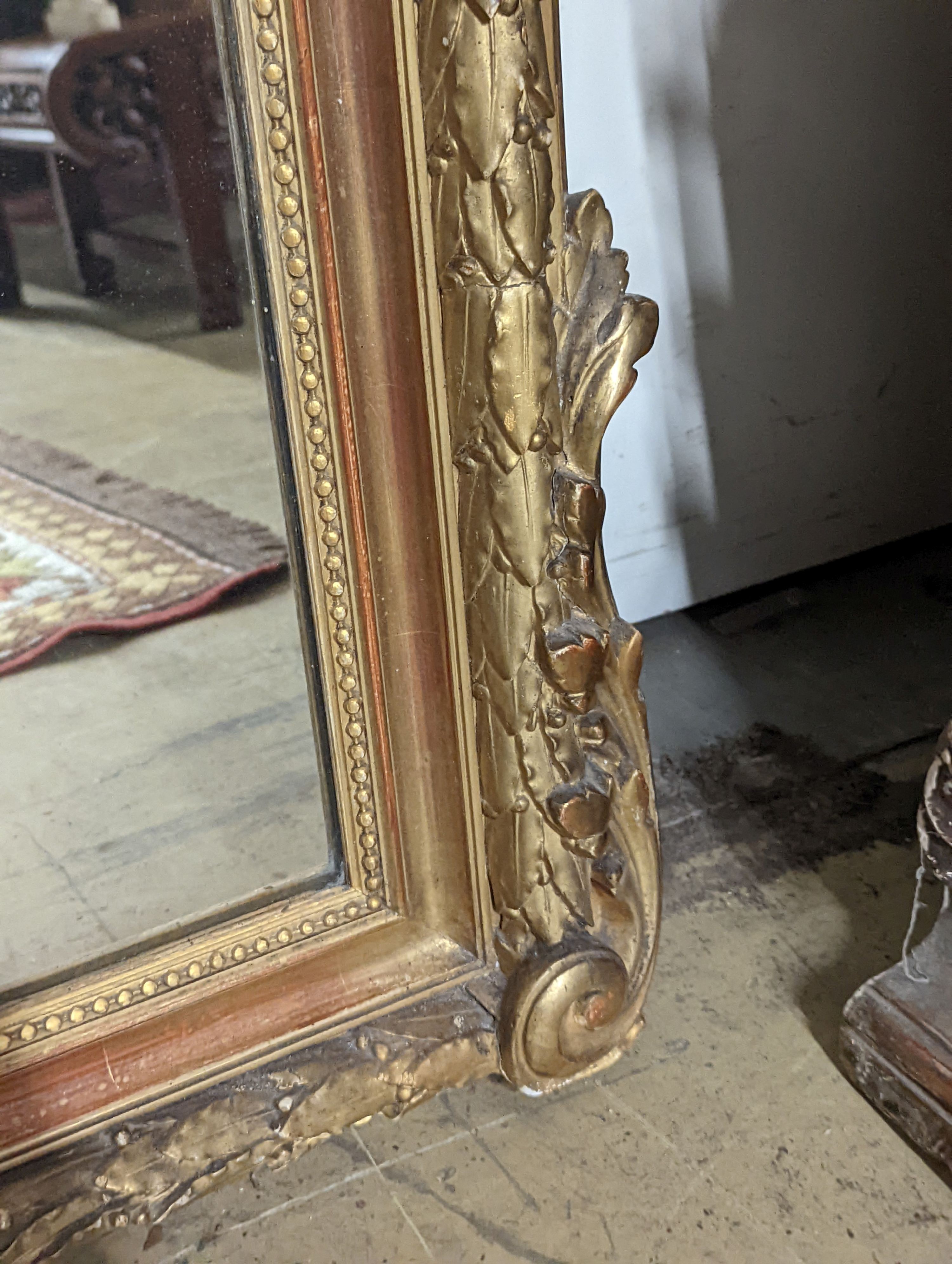 A 19th century French carved giltwood overmantel mirror, width 100cm, height 150cm